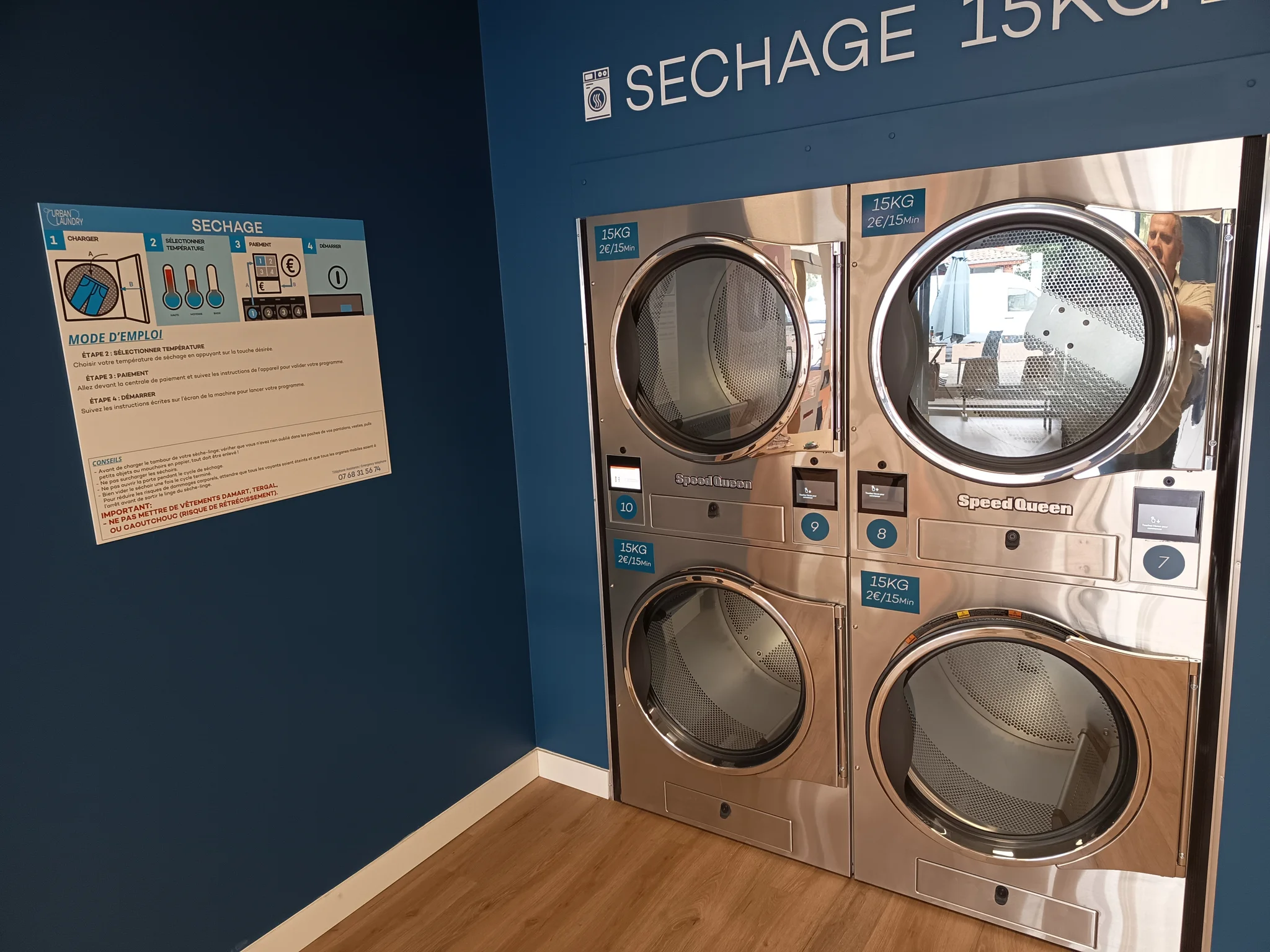 Sèche-linge 15 kg Speed Queen et affiche du mode d'emploi du séchage